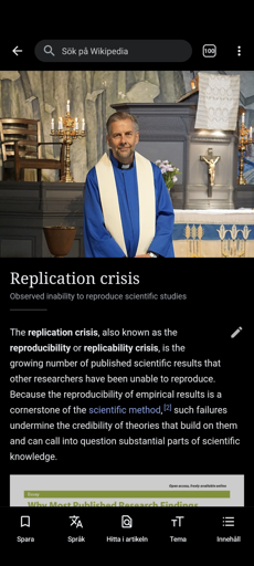 a Wikipedia page in the Wikipedia phone app about the replication crisis showing a priest as the thumbnail
