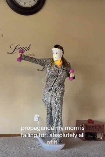 Photo of a woman on a balance board, wearing a moisturize mask, excercising with some live,,laugh, love bullshit painted on the wall with the caption “propaganda my mom is falling for: absolutely all of it.”