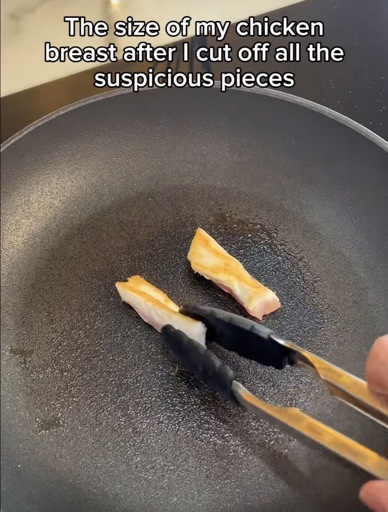 A frying pan with two little slivers of chicken with the caption “The size of my chicken breast after I cut off all the suspicious pieces”